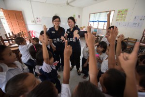 Volunteers engaging with the local school students