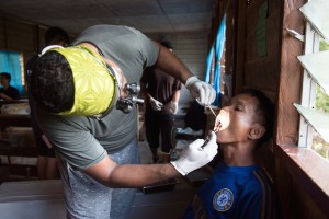 Dr Desaraj, a dentist, checking for cavities for the villagers. 