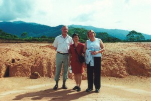 Photograph of Bob Oldroyd, Khan and Lynne Tucker standing on the site of the future Malaysia campus of the University of Nottingham