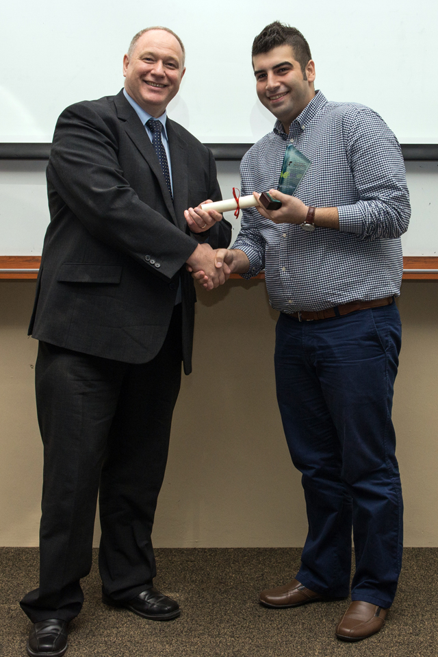 Professor Graham Kendall presenting Reza with the People's Choice award